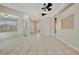 Expansive living room with stylish tile flooring and multiple entryways for an open feel at 4727 Starboard Dr, Bradenton, FL 34208