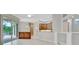 Open living space with kitchen view and access to the outdoor patio at 4727 Starboard Dr, Bradenton, FL 34208