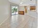 Spacious living room with sliding doors leading to the pool area for seamless indoor-outdoor living at 4727 Starboard Dr, Bradenton, FL 34208