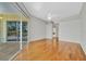 Expansive primary suite with wood floors, a ceiling fan, and a sliding door with views of the pool at 4727 Starboard Dr, Bradenton, FL 34208