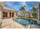 Refreshing screened-in pool with a stone tile patio and access to the home's interior at 4727 Starboard Dr, Bradenton, FL 34208