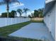 A backyard featuring a newly painted patio, a privacy fence, and well-maintained grass at 481 Saturn Ave, Sarasota, FL 34243
