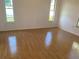 Bright bedroom with hardwood floors and windows at 481 Saturn Ave, Sarasota, FL 34243