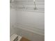 Walk-in closet with white wire shelving and laminate floors for maximum storage capacity at 481 Saturn Ave, Sarasota, FL 34243