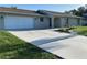 Charming home with a new driveway and updated landscaping with palm trees at 481 Saturn Ave, Sarasota, FL 34243