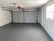 Clean, freshly painted two-car garage with modern lighting and an automatic door at 481 Saturn Ave, Sarasota, FL 34243