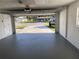 Spacious two-car garage with a freshly painted floor and a clear view to the home's exterior at 481 Saturn Ave, Sarasota, FL 34243