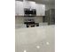 Modern kitchen features stainless steel appliances and white cabinets at 481 Saturn Ave, Sarasota, FL 34243