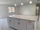 Open-concept living room featuring marble floors, recessed lights and a huge white kitchen island at 481 Saturn Ave, Sarasota, FL 34243