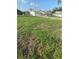 Large vacant lot with grass, ready for development, located in a neighborhood of single-Gathering homes at 481 Saturn Ave, Sarasota, FL 34243