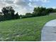 Expansive vacant lot ideal for building with lush greenery and mature trees at 481 Saturn Ave, Sarasota, FL 34243