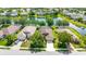Scenic aerial view of homes in a community with lush landscaping and a serene lake at 5005 Torrey Pines Run, Bradenton, FL 34211