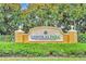 Entrance to Central Park at Lakewood Ranch, surrounded by lush greenery at 5005 Torrey Pines Run, Bradenton, FL 34211