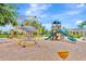 Community playground featuring modern play structures and a safe, wood-chip ground cover, perfect for Gathering fun at 5005 Torrey Pines Run, Bradenton, FL 34211