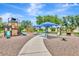 Community playground featuring slides, climbing structures, sunshades, and open space for Gathering fun and outdoor activities at 5005 Torrey Pines Run, Bradenton, FL 34211