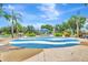 Community splash pad featuring patterned, blue-and-white water play area, seating, and lush landscaping, perfect for Gathering fun at 5005 Torrey Pines Run, Bradenton, FL 34211