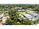 A home nestled among lush trees in a tranquil neighborhood, as seen from an aerial perspective on a sunny day at 5317 14Th S Ave, Gulfport, FL 33707