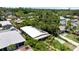 Aerial shot of a house surrounded by lush greenery, offering a glimpse of the neighborhood and landscaping at 5317 14Th S Ave, Gulfport, FL 33707