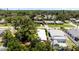 Aerial view featuring a home with lush landscaping, a well-maintained roof, and a serene neighborhood setting at 5317 14Th S Ave, Gulfport, FL 33707
