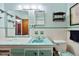 Charming bathroom with vintage tile work, dual mirrors, and ample counter space at 5317 14Th S Ave, Gulfport, FL 33707