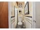 Narrow bathroom with retro tilework, modern toilet, and a compact design at 5317 14Th S Ave, Gulfport, FL 33707