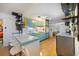 Kitchen boasts a breakfast bar, retro cabinets, and hardwood floors at 5317 14Th S Ave, Gulfport, FL 33707