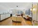 Bright living room featuring hardwood floors, large windows, and comfortable seating at 5317 14Th S Ave, Gulfport, FL 33707
