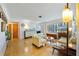 Bright living room with hardwood floors, large windows, and stylish mid-century modern furnishings at 5317 14Th S Ave, Gulfport, FL 33707
