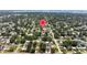 Aerial view pinpointing a house in a residential area with lush, mature trees at 5317 14Th S Ave, Gulfport, FL 33707