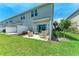 A well-maintained backyard with a patio area, green grass, and lovely landscaping at 5711 Archipelago St, Nokomis, FL 34275