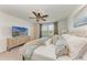 Relaxing bedroom with a comfy bed, decorative pillows, and a light neutral color scheme at 5711 Archipelago St, Nokomis, FL 34275