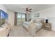 Cozy bedroom with neutral tones, a plush bed, and a ceiling fan for added comfort at 5711 Archipelago St, Nokomis, FL 34275