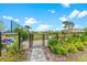Dog park with green space, providing a secure and enjoyable environment for pets and their owners at 5711 Archipelago St, Nokomis, FL 34275