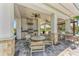 The pool area features a built-in outdoor grill and kitchen, providing a stylish cooking and dining space at 5711 Archipelago St, Nokomis, FL 34275