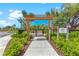 Inviting playground entrance with pergola, landscaped surroundings for outdoor Gathering fun at 5711 Archipelago St, Nokomis, FL 34275