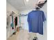 Organized walk-in closet with ample storage, including shelves and hanging rods at 5711 Archipelago St, Nokomis, FL 34275