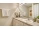Bathroom with double sinks, framed mirror, and stylish decor at 5905 Silver Sage Way, Sarasota, FL 34232