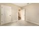 This carpeted bedroom has neutral walls and features an en suite bathroom and standard closet at 5905 Silver Sage Way, Sarasota, FL 34232