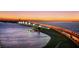 Scenic bridge view illuminated at night, offering a picturesque scene for waterfront properties at 5905 Silver Sage Way, Sarasota, FL 34232