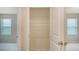 Walk-in closet featuring wire shelving for optimal storage, with access to the bedrooms on either side at 5905 Silver Sage Way, Sarasota, FL 34232