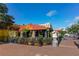 Lively restaurant exterior with colorful accents, outdoor seating, and lush greenery at 5905 Silver Sage Way, Sarasota, FL 34232