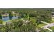 Overhead view of the home featuring a lake, trees, and landscaping at 601 136Th St E Ct, Bradenton, FL 34212