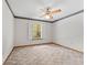 Bedroom featuring a ceiling fan, neutral carpet, and a window with exterior view at 601 136Th St E Ct, Bradenton, FL 34212