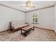 Bedroom features a ceiling fan, a futon and a large window with view at 601 136Th St E Ct, Bradenton, FL 34212
