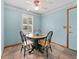 Cozy breakfast nook features shuttered window with seating for three guests at 601 136Th St E Ct, Bradenton, FL 34212