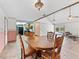 Open dining area with backyard pool view, seamlessly connects to the kitchen and living room at 601 136Th St E Ct, Bradenton, FL 34212