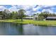 Waterfront home with a screened-in lanai and spacious yard, offering serene views and outdoor enjoyment at 601 136Th St E Ct, Bradenton, FL 34212