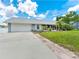 Charming single-story home with a well-maintained lawn, screened lanai, and two-car garage at 601 136Th St E Ct, Bradenton, FL 34212