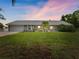 Charming single-story home with a well-maintained lawn, screened lanai, and a two-car garage at 601 136Th St E Ct, Bradenton, FL 34212