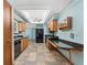 Functional kitchen featuring a black fridge, breakfast bar, and ample counter space at 601 136Th St E Ct, Bradenton, FL 34212